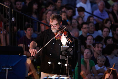 Todd Reynolds performing in Allison Orr's PowerUp in Austin, with a score by Graham Reynolds. Photo by Amitava Sarkar.