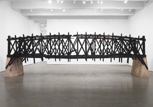 Marianne Vitale. Burned Bridge, 2012. Reclaimed lumber. Photo courtesy of Zach Feuer Gallery, New York.