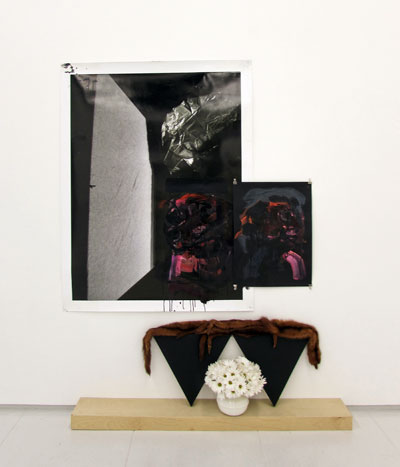 Raychael Stine, Moons for Moons, 2012.  Digital photograph, acrylic paint, black bond, postcard, triangle canvas, wooden shelf, weasel pelts, women's spittoon, white daisy mums.  6' x 6' x 10". Courtesy of the artist and Art Palace.