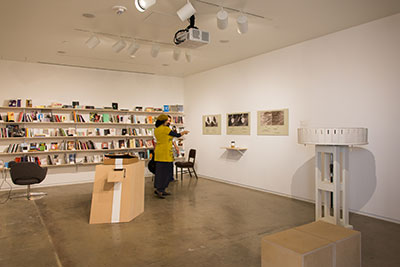 Visitors viewing Efraín Velasco's stereoscopic poems at Antena @ Blaffer, Blaffer Art Museum, Houston Photography: Pablo Giménez Zapiola; Courtesy the artists and Blaffer Art Museum.