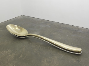 Subodh Gupta, Spooning, 2009. Stainless steel and brass (unique). 13.3 x 108.25 x 20.5 inches. Courtesy the artist and Hauser & Wirth. Photograph by Thomas Müller.