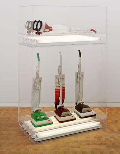 Jeff Koons New Hoover Convertibles, Green, Red, Brown, New Hoover Deluxe Shampoo Polishers, Yellow, Brown Doubledecker, 1981-87 Three vacuum cleaners, two shampoo polishers, and fluorescent lights in Plexiglas casing Overall 82 5/8 x 54 x 28 inches Courtesy: Glenstone Photo: Tim Nighswander © Jeff Koons 