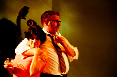 Gloria Sanchez as Martha  and David Connelly as George in the AtticRep production of Edward Albee's Who's Afraid of Virginia Woolf. Photo by Siggi Ragnar.