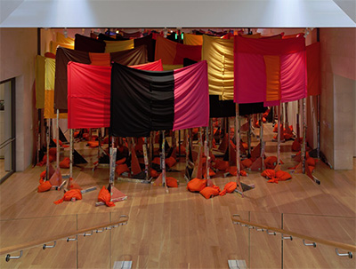 Phyllida Barlow, untitled:100banners2015, 2015 Lumber, plywood, tape, wadding, fabric, paint, sand, and plastic 157 1/2 x 511 3/4 x 511 3/4 in. (400 x 1300 x 1300 cm) Courtesy of the artist and Hauser & Wirth 