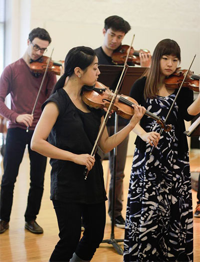 Natalie Lin Natalie Lin leading rehearsal for "Bridge to Britten".