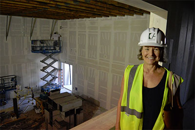 Nancy Wozny at Main Street Theater’s Rice Village theater during construction. Photo by Joe Kirendall.