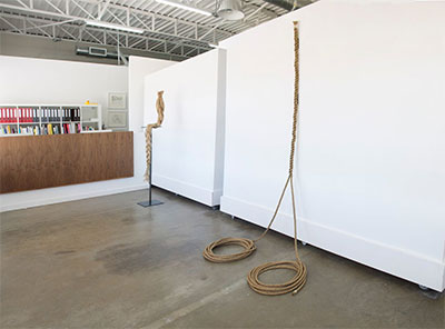 Where You End and I Begin Installation- Frances Bagley, Perch, 2000, Organic fibers and steel, 74 x 17 x 13 in; Ryan Burghard, Hold, 2015, Spliced manilla rope, 5-8 x 45 in. Image courtesy the artists and Cydonia.
