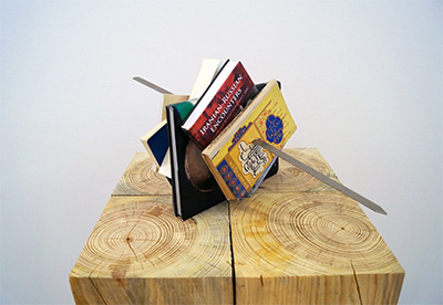 Slavs and Tatars, Kitab Kebab (USA Tudeh), 2014. Books, metal kebab skewer, ~ 50 x 50 x 50cm. Collection of Fred and Soody Sharifi. Courtesy the artists and Tanya Bonakdar Gallery.