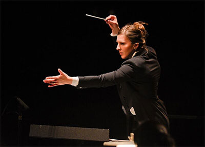 Lidiya Yankovskaya from the U.S. conducting The Dallas Opera Orchestra. Photo by Karen Almond, Dallas Opera.