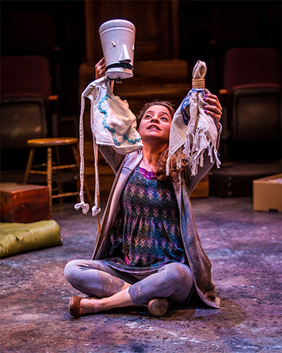 Gricelda Silva transforms every-day objects into puppets in ZACH Theatre's 2015 bilingual production of Cenicienta in partnership with Teatro Vivo. Photo by AxelB Photography.