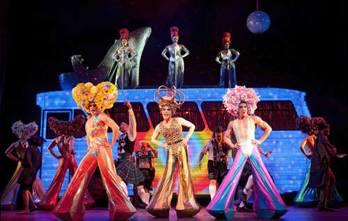 Wade McCollum, Scott Willis and Bryan West  bring color and flash (not to mention, some flesh) to “Priscilla Queen of the Desert The Musical.”