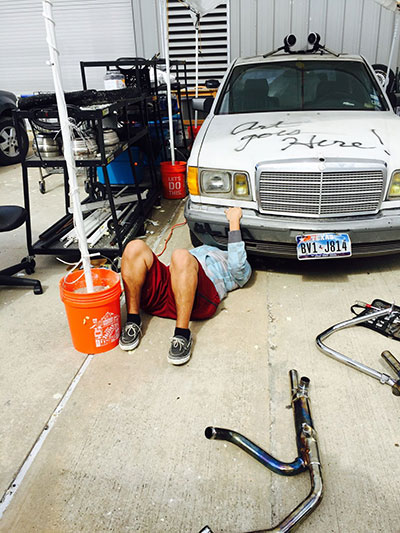 A Reagan High School student works on their entry for the 2015 Houston Art Car Parade. Photo by Rebecca Bass