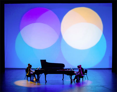 Marilyn Nonken, left and Sarah Rothenberg, right in Sacred Visions: Messiaen and Stravinsky at Wortham Theater Center, May 2, 2015 with lighting design by Jennifer Tipton. Photo by Ben Doyle