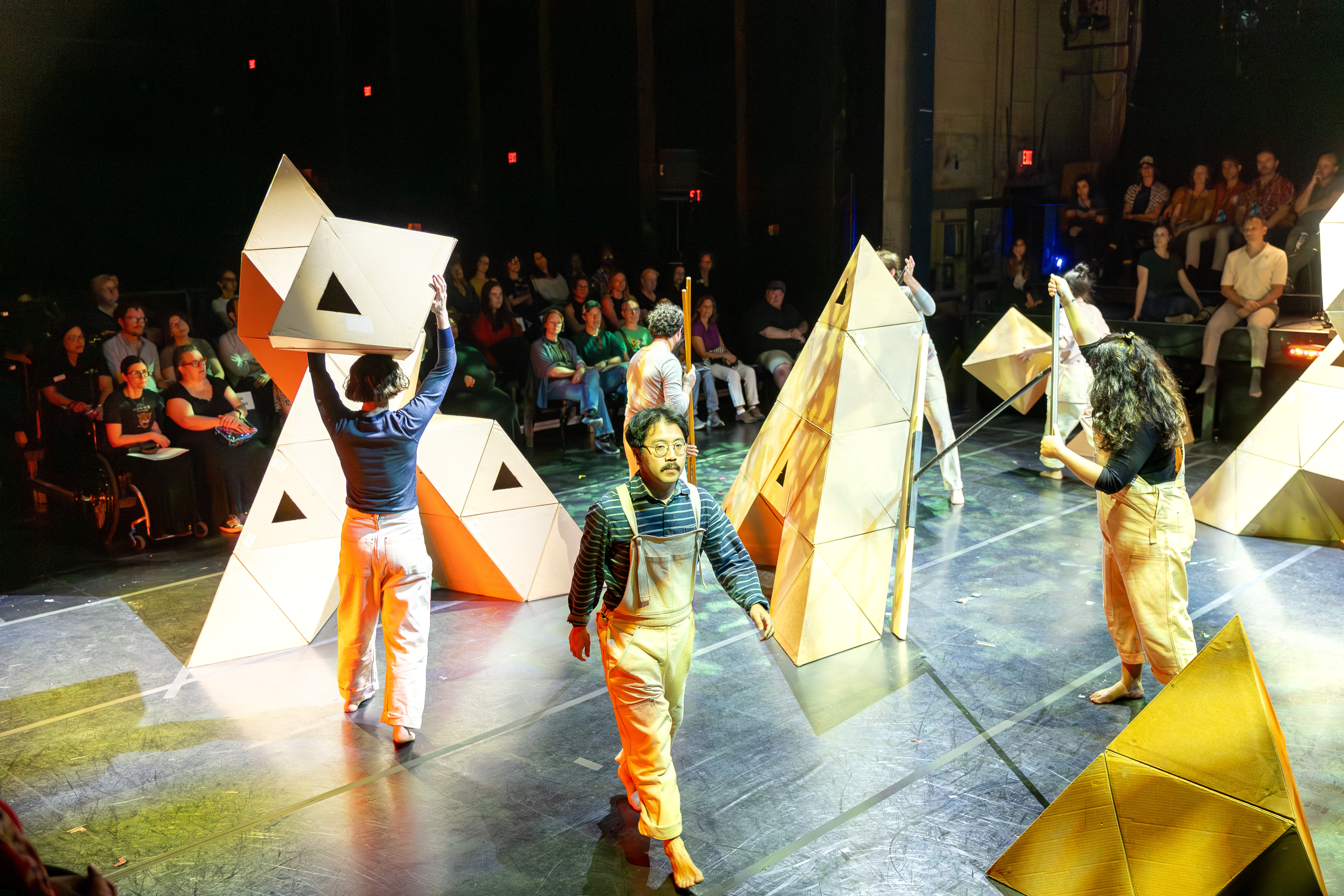 Rude Mechs performers building geometric mountain forms during Not Every Mountain at Fusebox 2026.