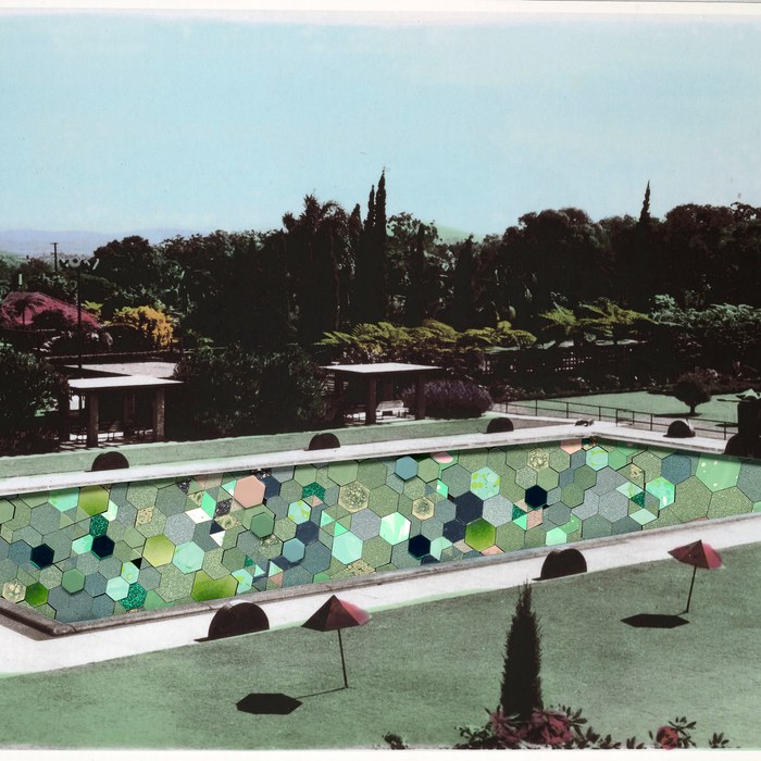 Resort swimming pool filled with colorful geometric collage fragments.